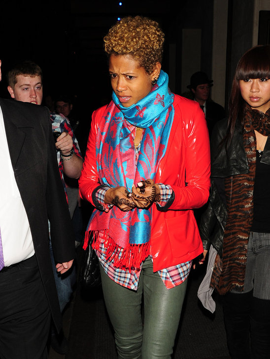 Kelis is bright and cheerful in sizzling red and bright blue