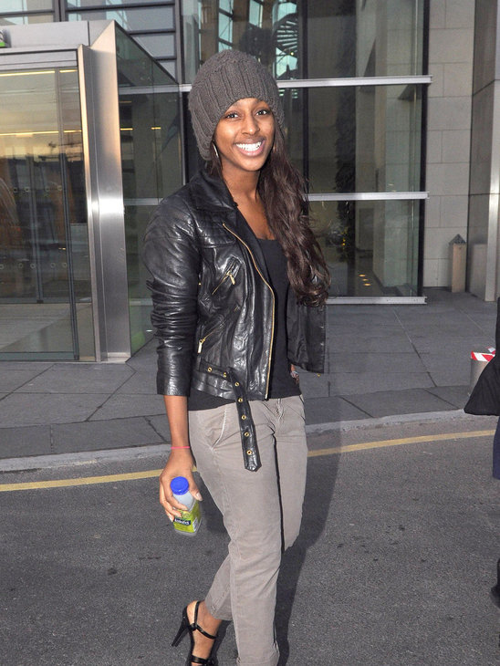 Alexandra Burke in a classic leather jacket and beanie. She looks cute for a change!