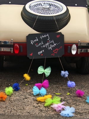 Black chalkboard with pompoms and ribbons, 45 x 30 cm Black chalkboard with pompoms and ribbons, 45 x 30 cm